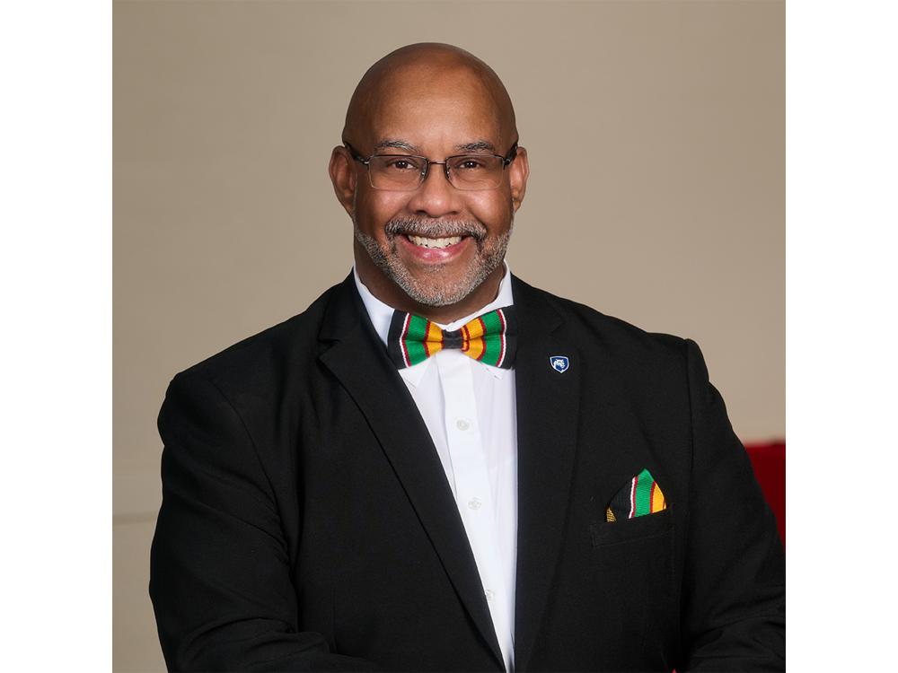 Portrait of a person wearing glasses and a bowtie