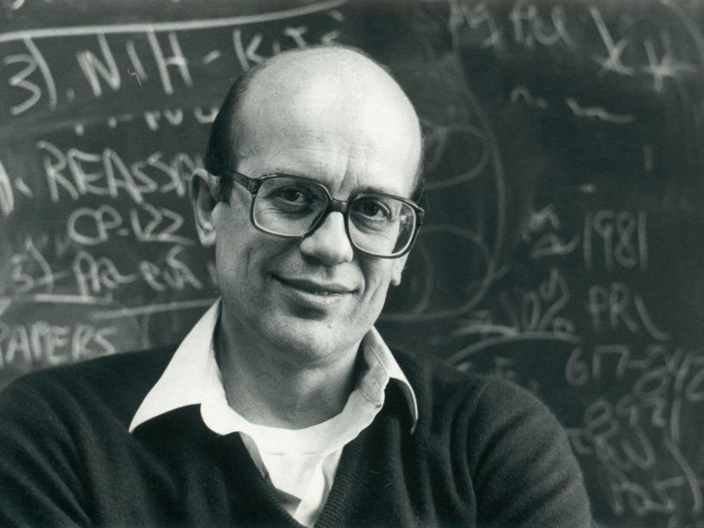 Wesley Hymer in front of chalkboard