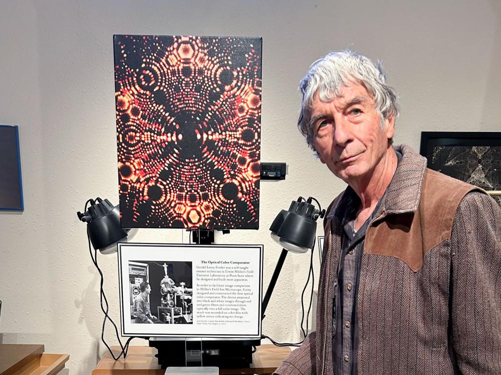 Panitz stands in front of vintage physics equipment in his museum