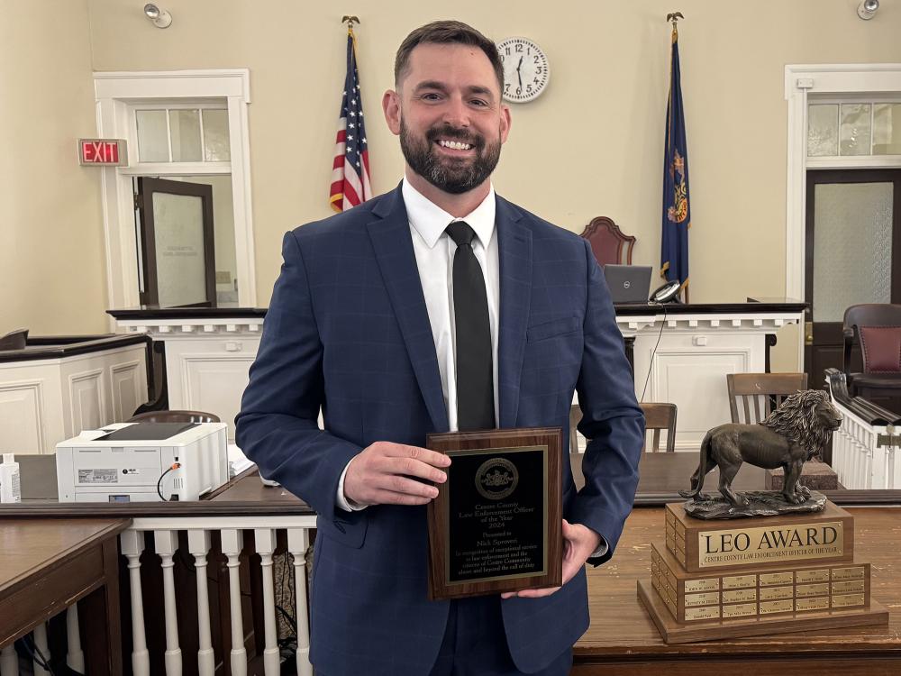 Sgt. Nick Sproveri with Law Enforcement Officer of the Year and commemorative award