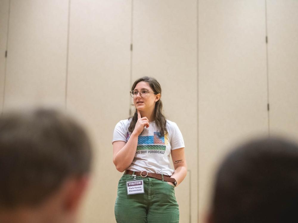 Emma Steinebronn standing in front of students at Park Forest Elementary School.