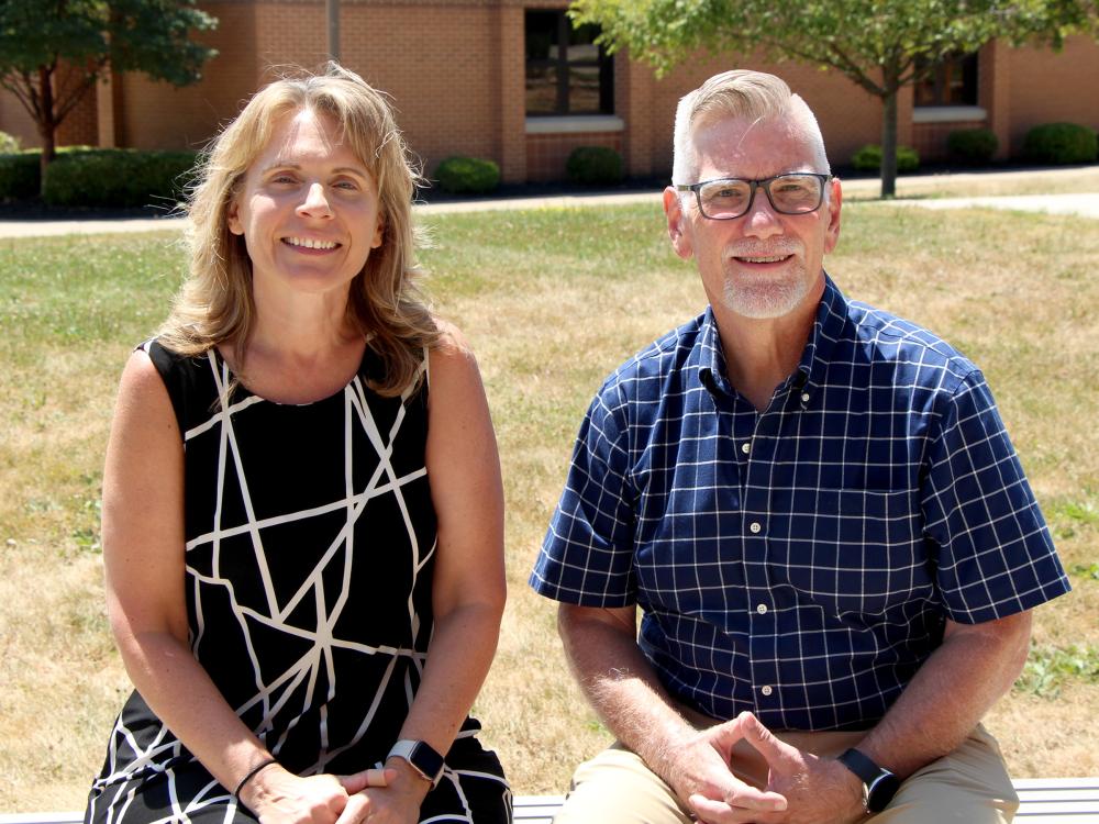 Leanne Nedza (left), lecturer in criminal justice, and Scott Muirhead (right), lecturer in business administration, photographed on the campus of Penn State DuBois. Both were recognized for their innovative teaching efforts with the inaugural Teaching and Learning with Technology (TLT) New Faculty Recognition Award.