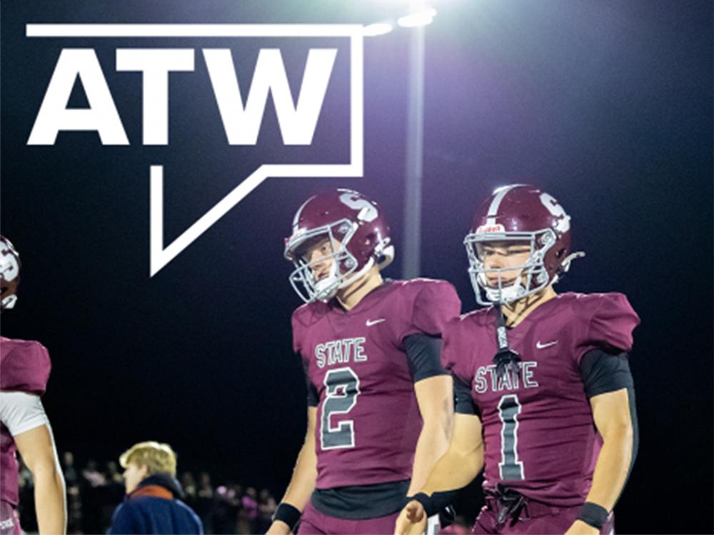 Two football players in maroon uniforms
