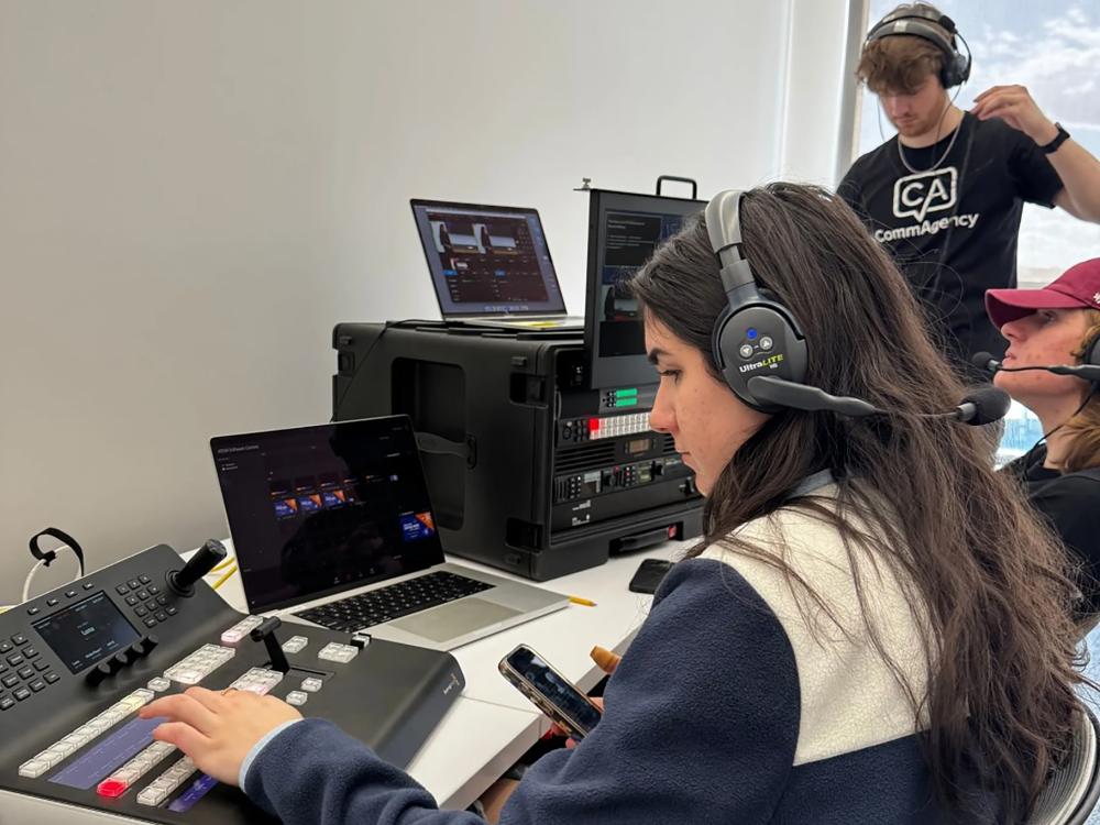 CommAgency students work on equipment