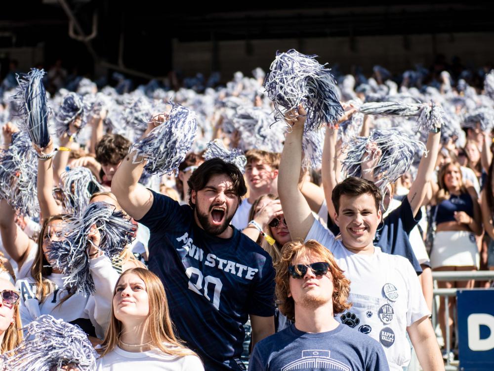 A student yelling in the fan section
