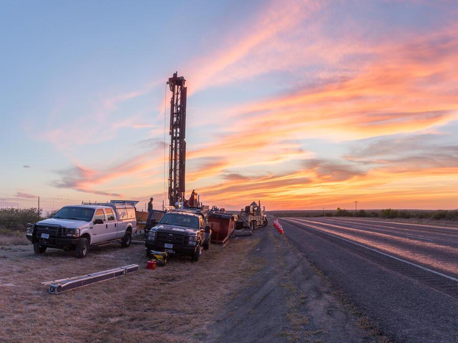A coring and geophysical well-logging operation into the Eagle Ford Group formation is seen adjacent to U.S. Route 90 in Kinney County, Texas