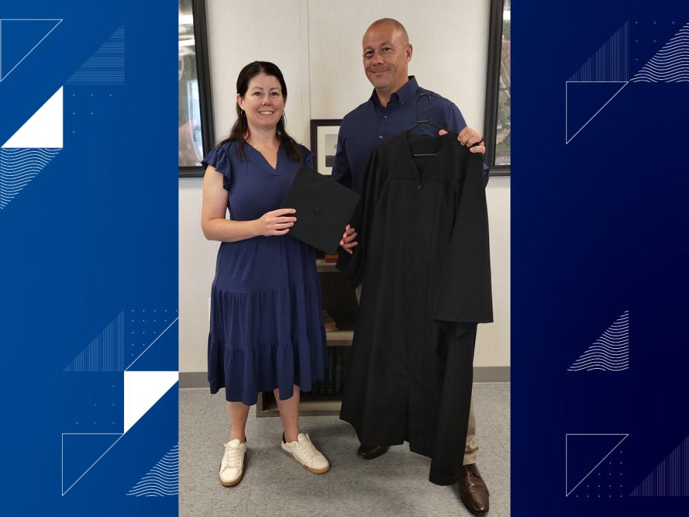 Professor Jennifer Murphy shares donation with Jeffrey R. Smith, warden of the Berks County Jail System