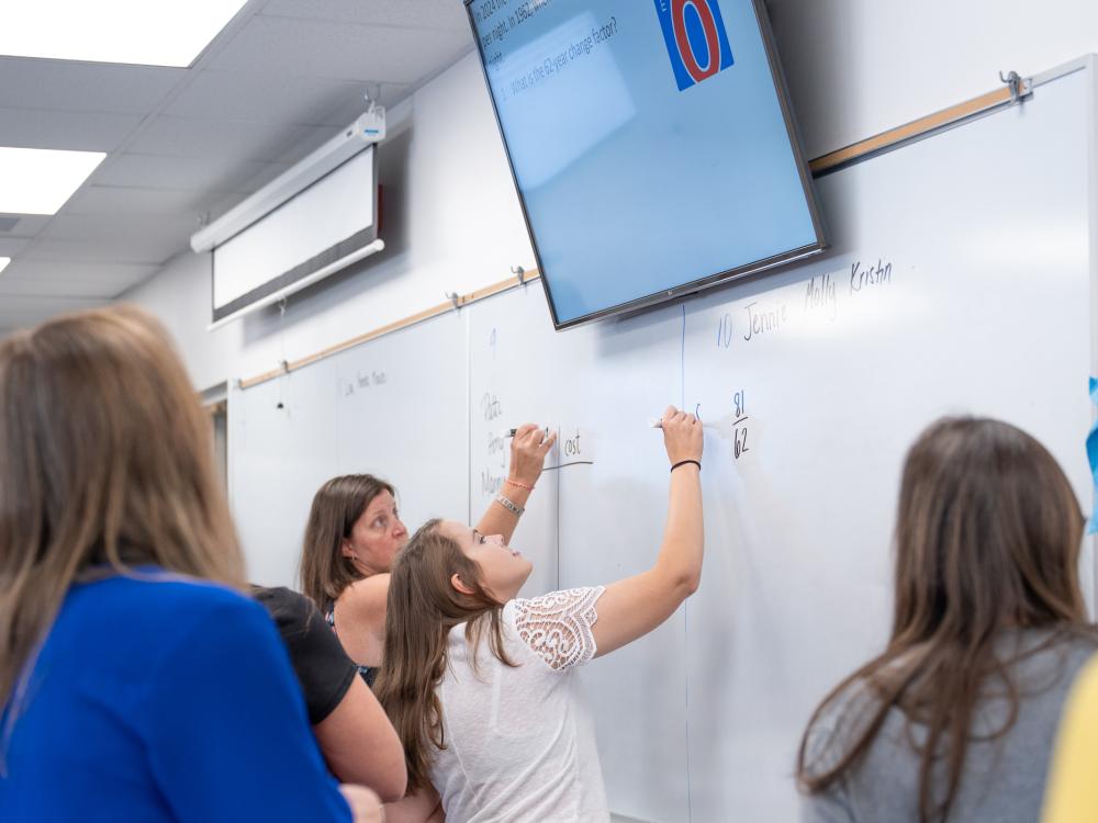 An instructor teaches in a classroom