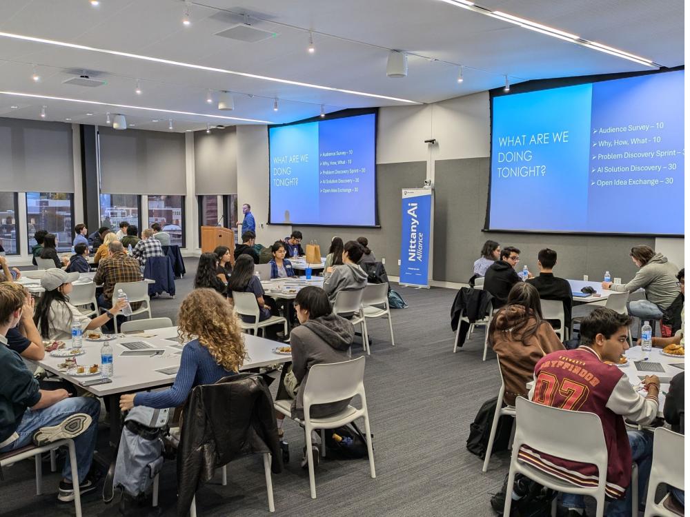 speaker presents slides to full conference room
