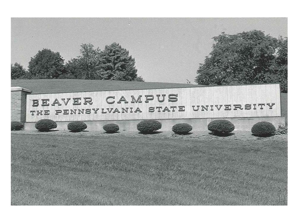 A black and white photo of the original entrance sign to campus that says Beaver Campus The Pennsylvania State University