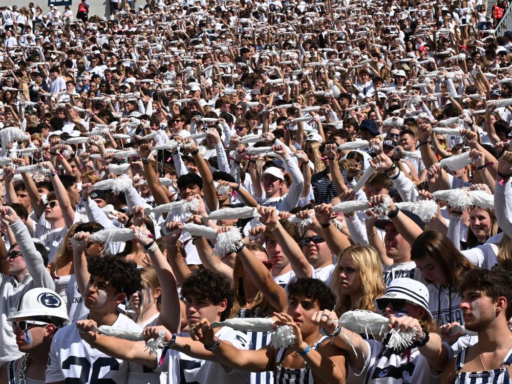 students holding shakers at Beaver Stadium