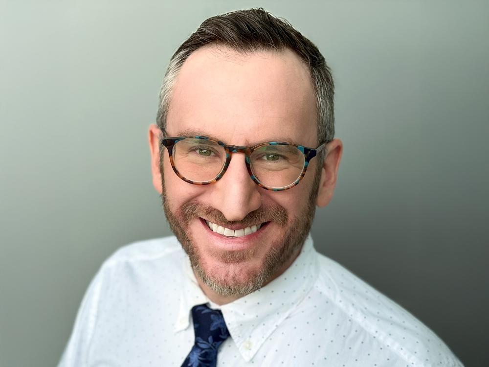 A head and shoulders photo of a smiling Stuart Shapiro
