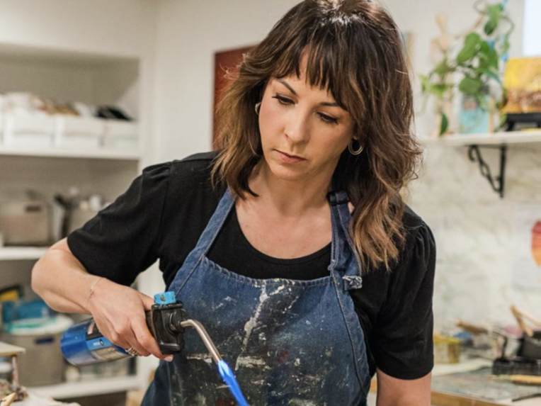 Artist Terri Yacovelli creating encaustic wax artwork.