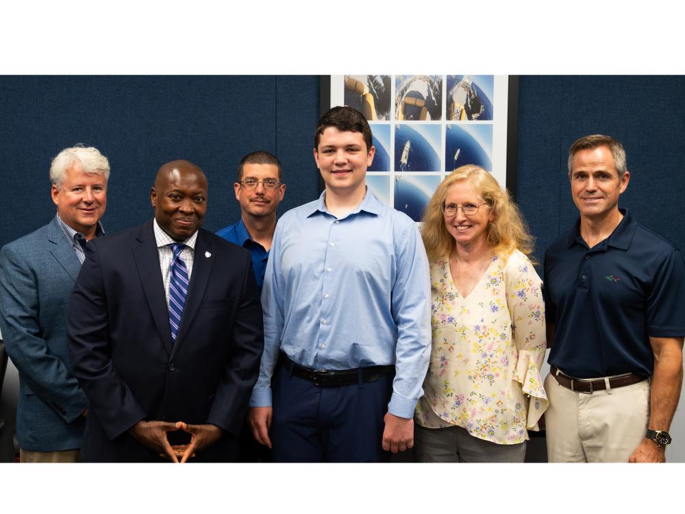 A group photograph of ARL leadership posing with the recipient of the Josiah Christophel internship and members of the Christophel family
