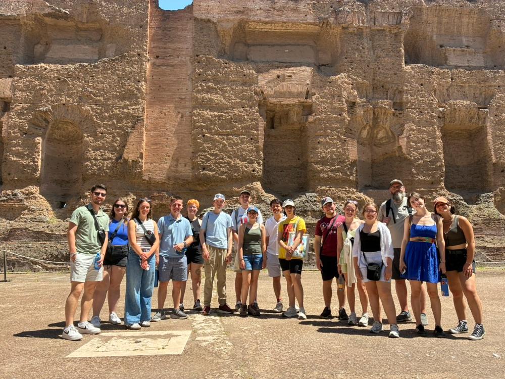 Students standing at the Baths of Caracalla in Rome.