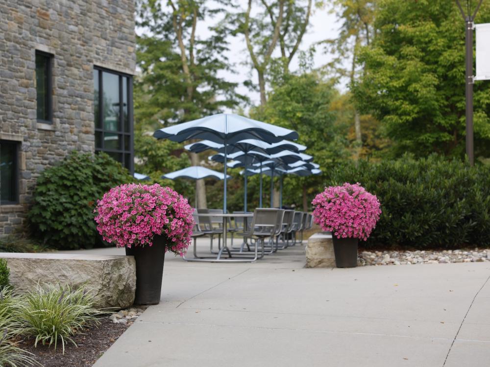 Outside of the Student Union, with pink flowers