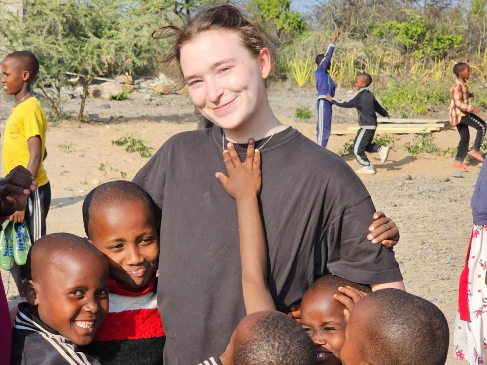 Adelaide surrounded by five Tanzanian children