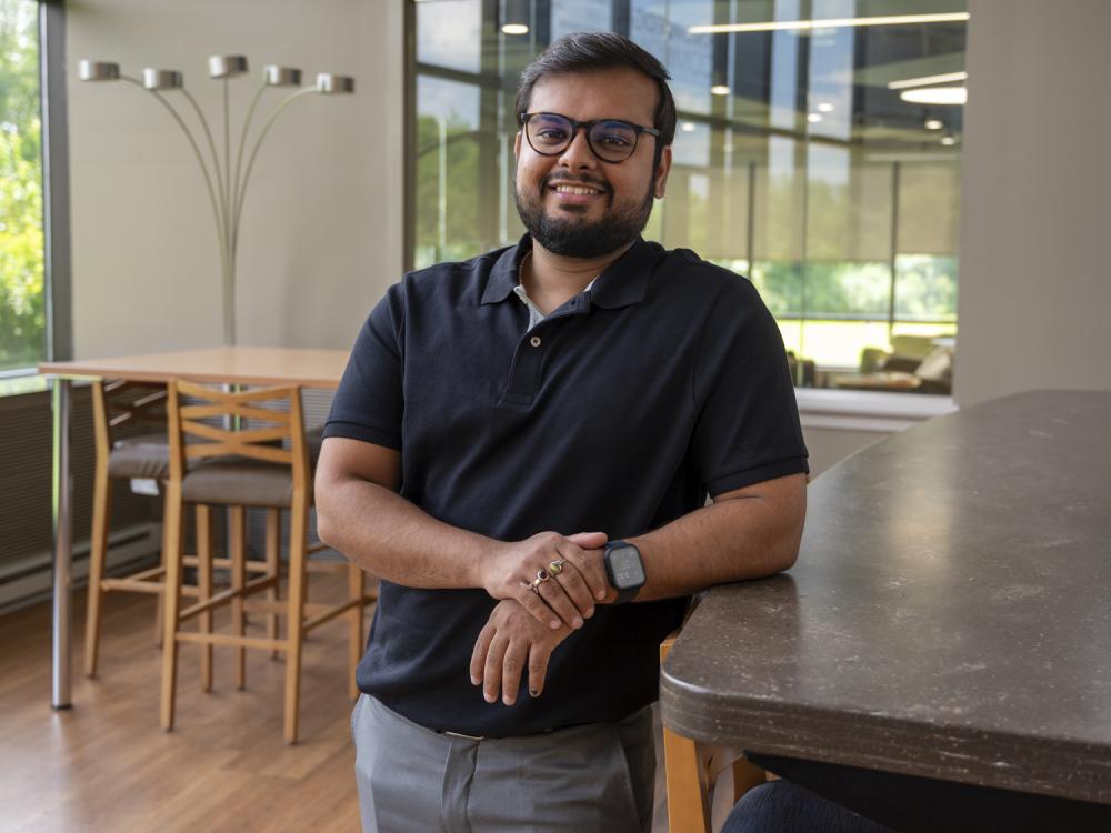 Bharat Sharma, data analytics alumnus, stands in a lounge at Penn State Great Valley