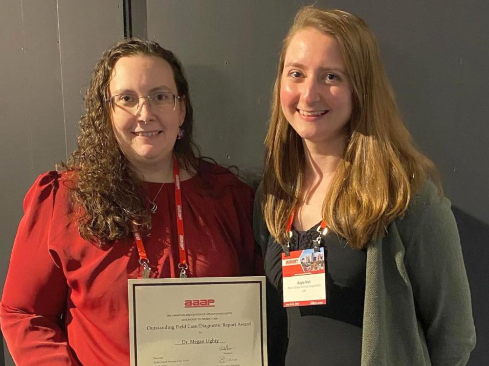 Megan Lighty, left, and Kayla Niel at 2025 American Association of Avian Pathologists annual meeting
