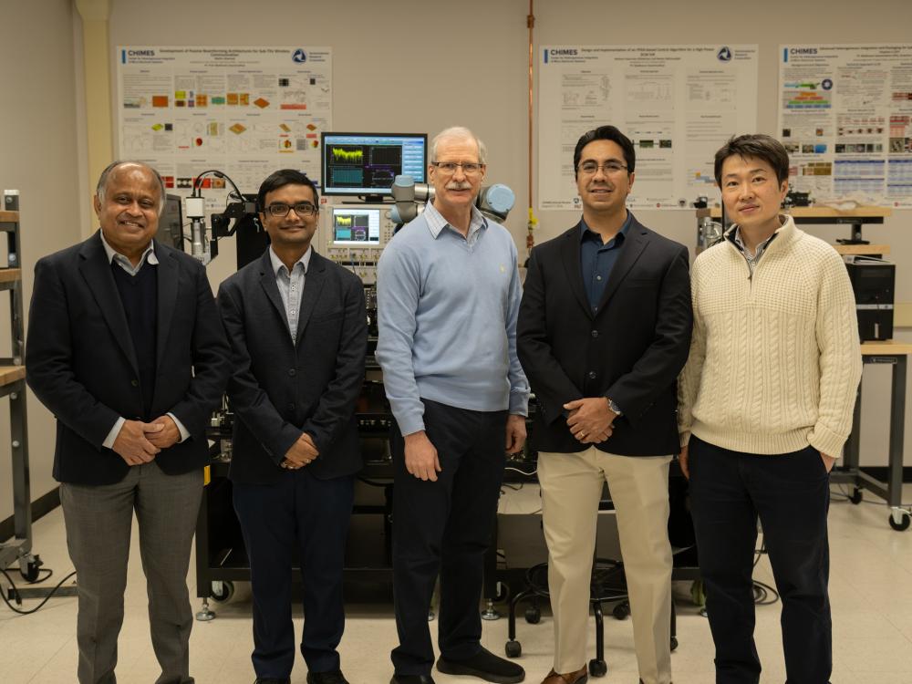 A group of people standing in a lab