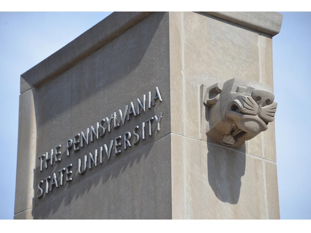Close up of Pollock Gates with the lion's head on one side and The Pennsylvania State University on the other