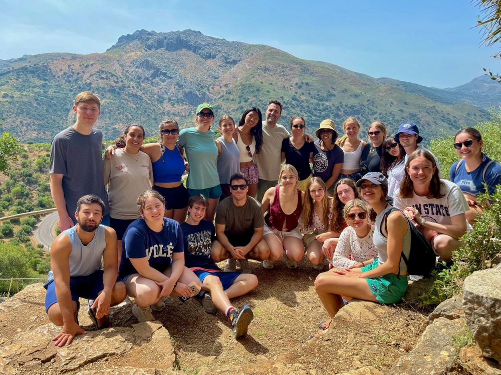Students and faculty gather atop a scenic vista in Spain.