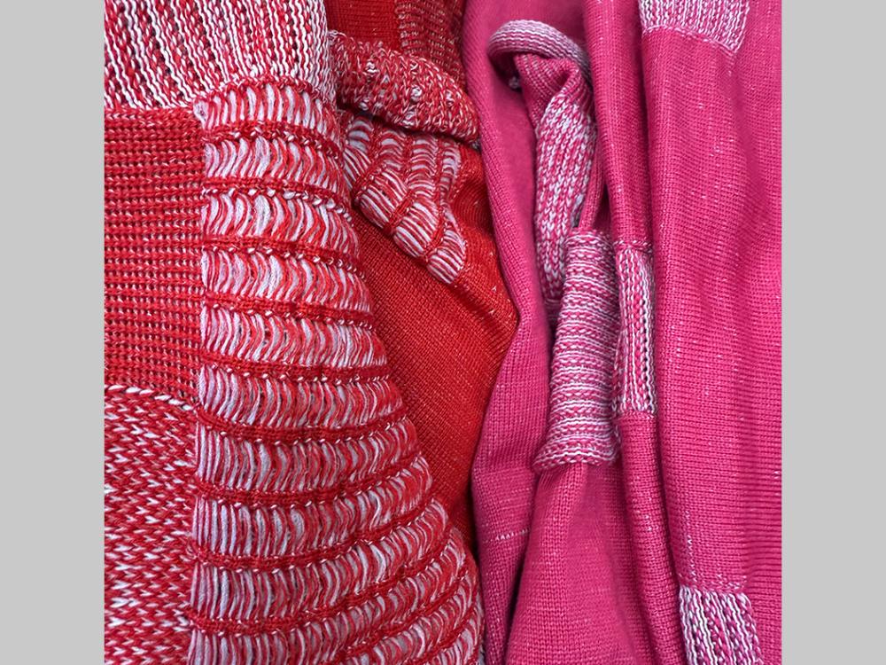 Red, white, and pink woven fabrics.