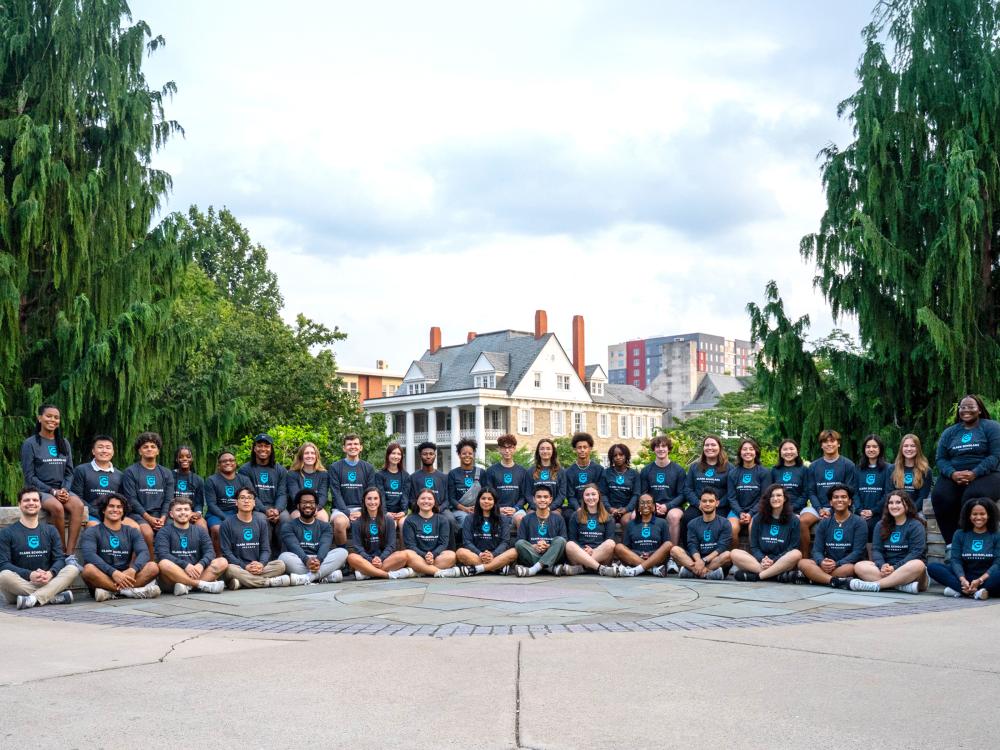 a group of students poses outside