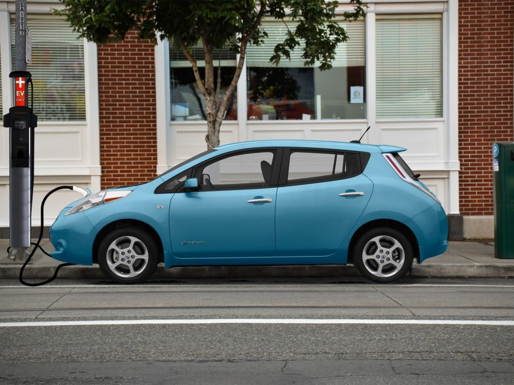 A car at an EV charging station