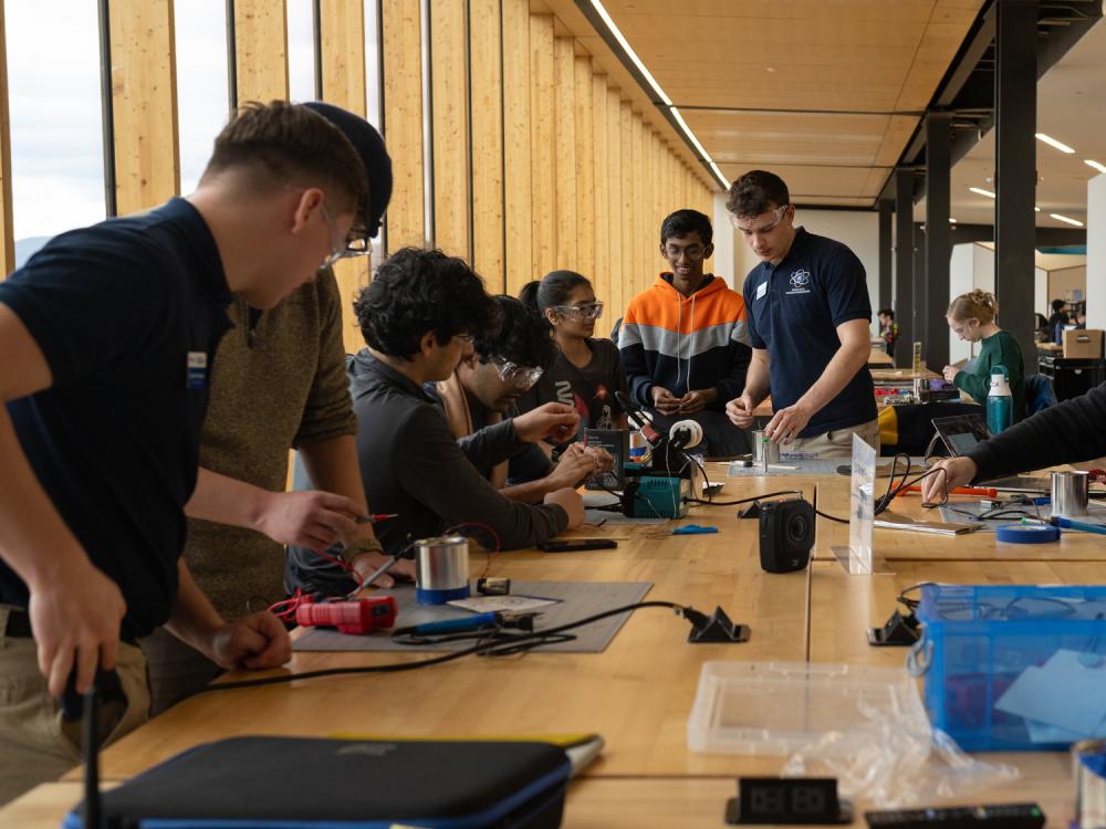 Students work with equipment in The Learning Factory