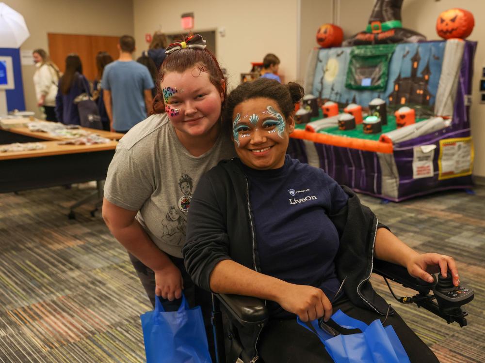 students with faces painted