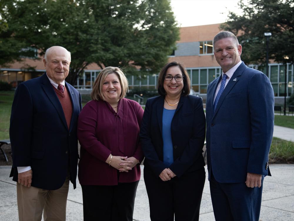 David Caddick, Lori Suski, Michele Torres, and John Yudichak pose for a group photo on Penn State Harrisburg campus