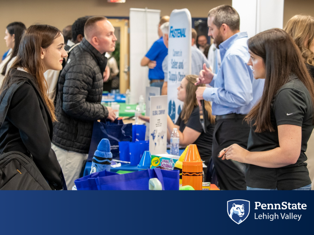 a Penn State Lehigh Valley student speaks with a job recruiter at the Business and Technology Job Fair