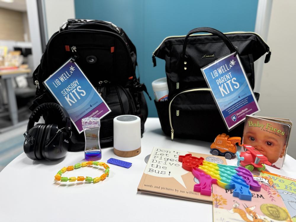 two black backpacks with assorted materials and toys around them