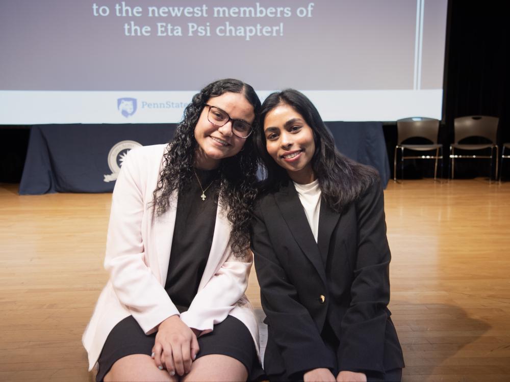 Marola Anes and Methmi Muthgala sitting on a stage