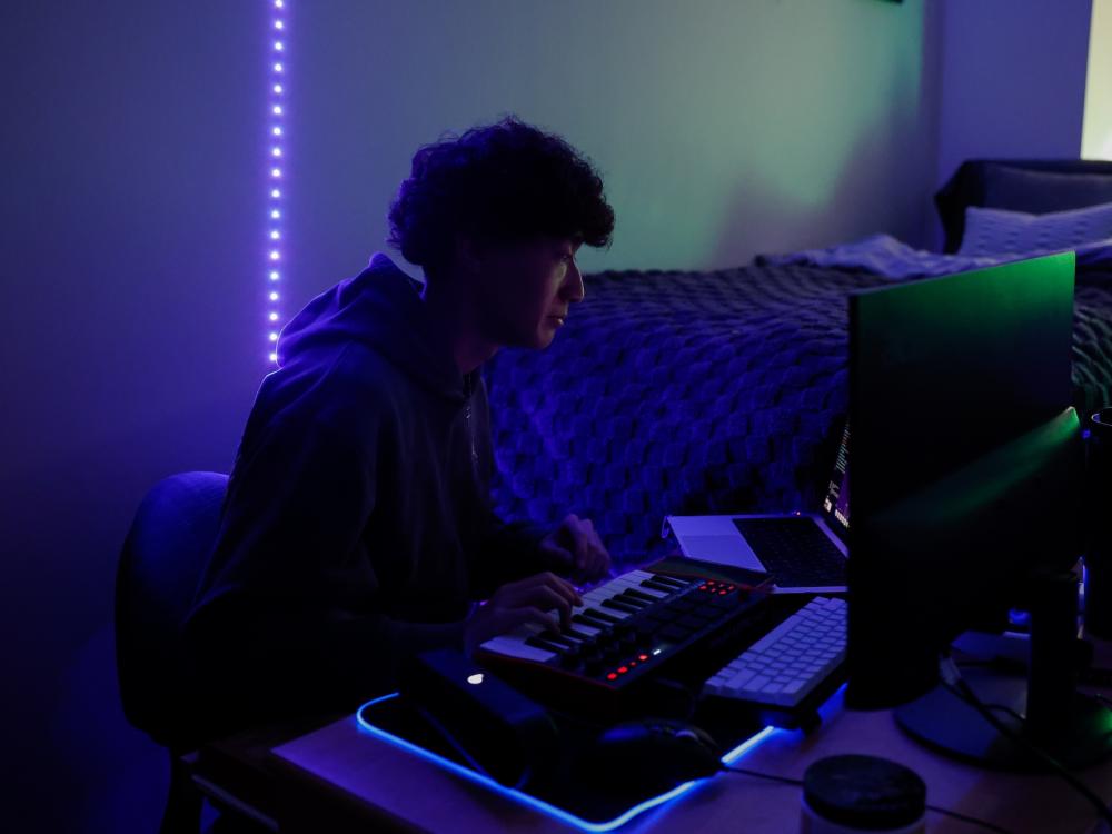 Matthew Chang making beats in his room in Orchard Hall