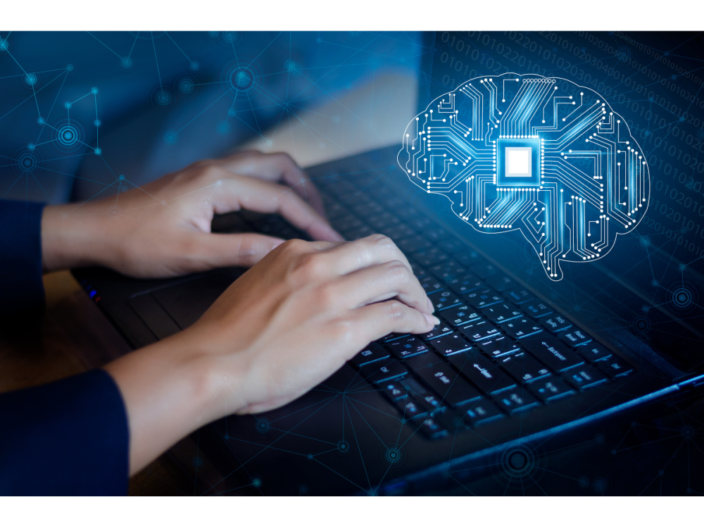 Hands type on a computer with brain technology scan in blue.