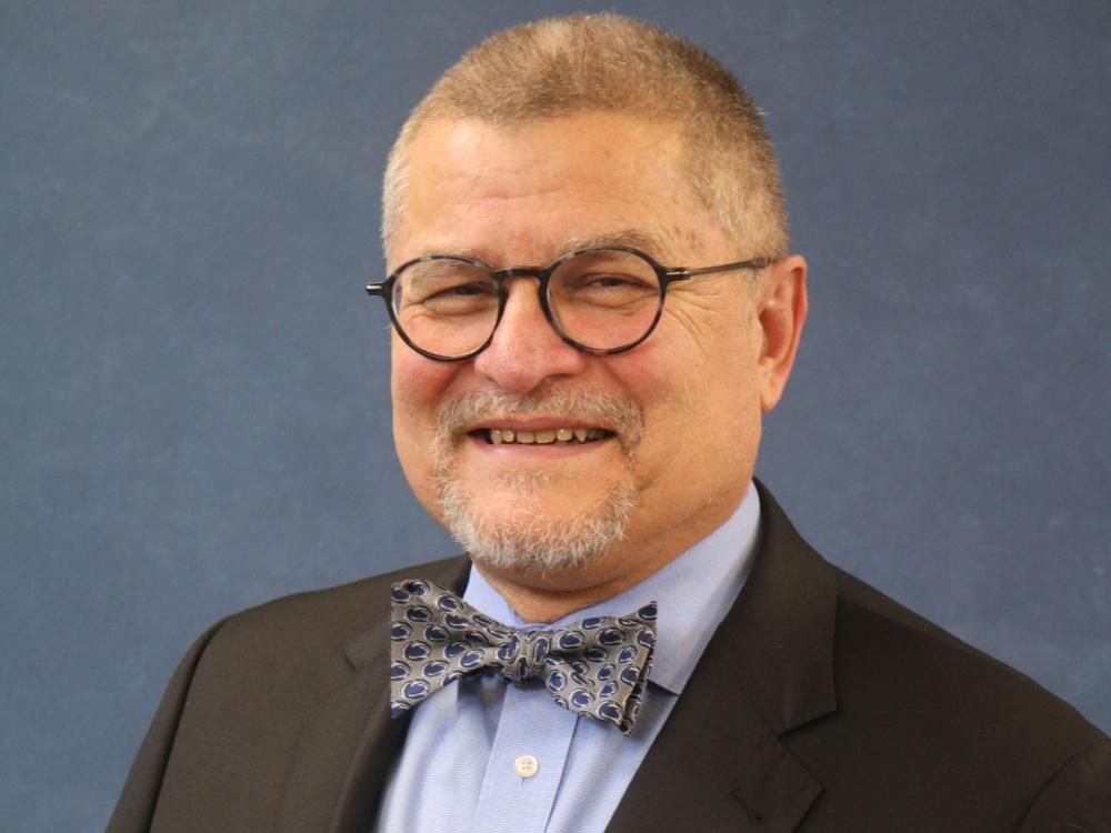 A headshot photo of Michael Doncheski wearing a shit and bow tie