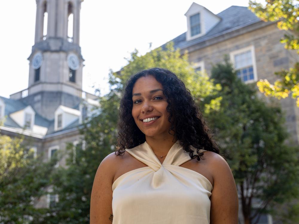 Jasmin Tanner stands in front of Old Main at Penn State University Park.