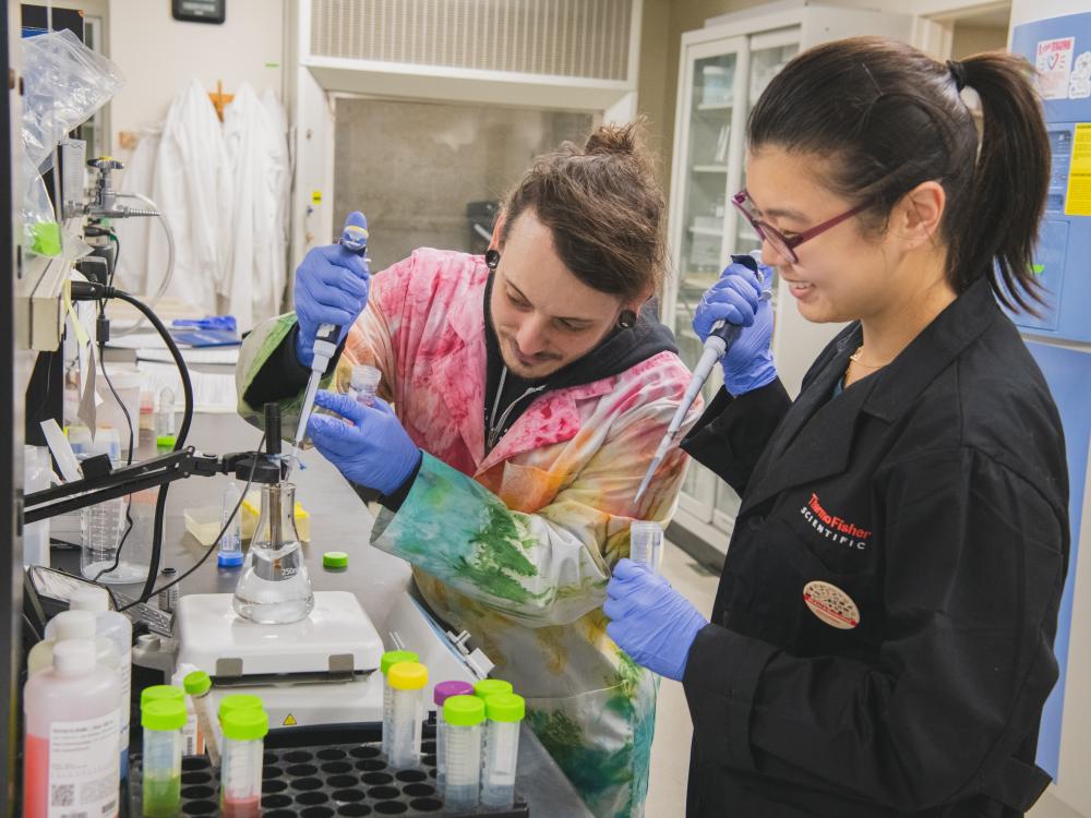 Chad Smies, 5th year graduate student, and Jiyeon (Joan) Baek, postdoctoral scholar, pH a solution that will be used to visualize protein expression in the mouse brain.