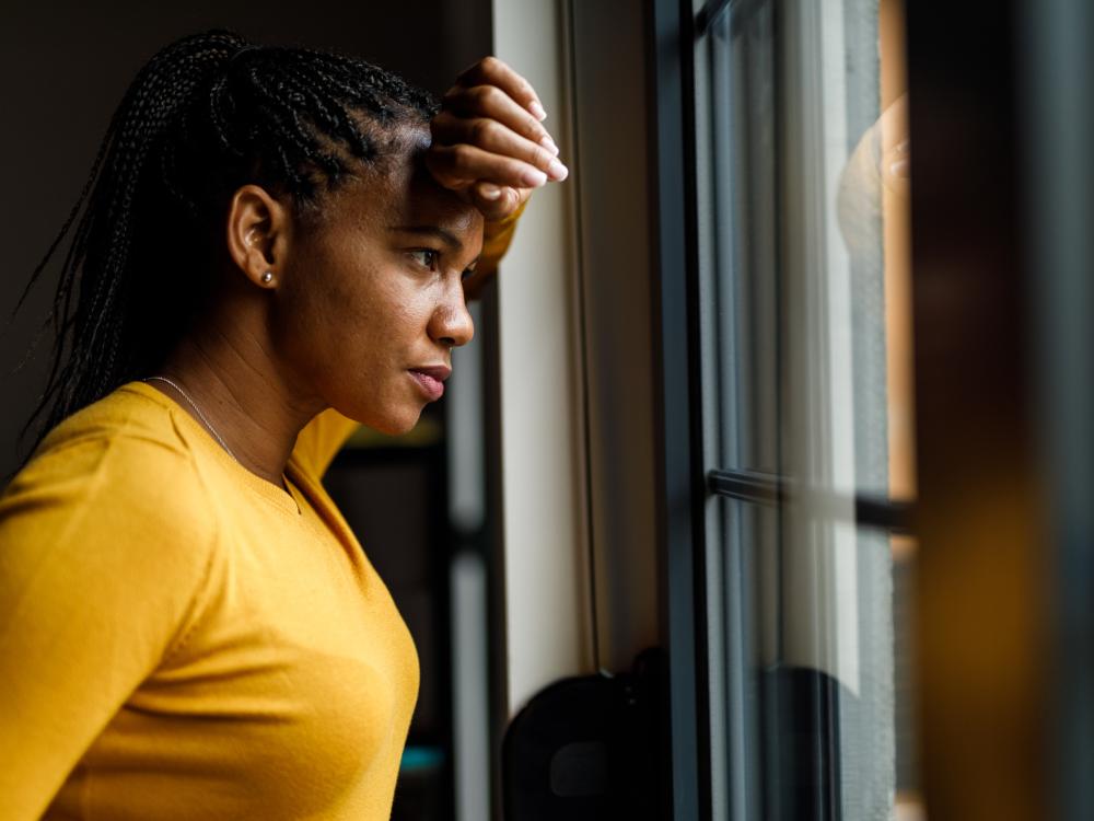 Person leaning against the window, looking outside