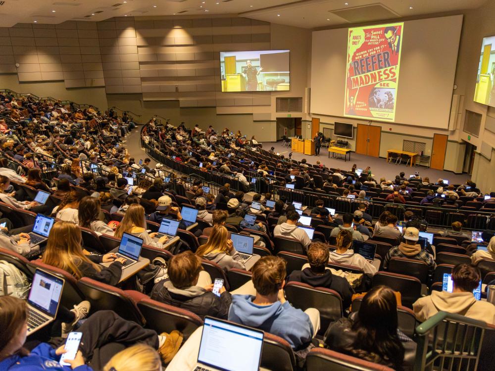 Kirk French lectures to an auditorium filled with students