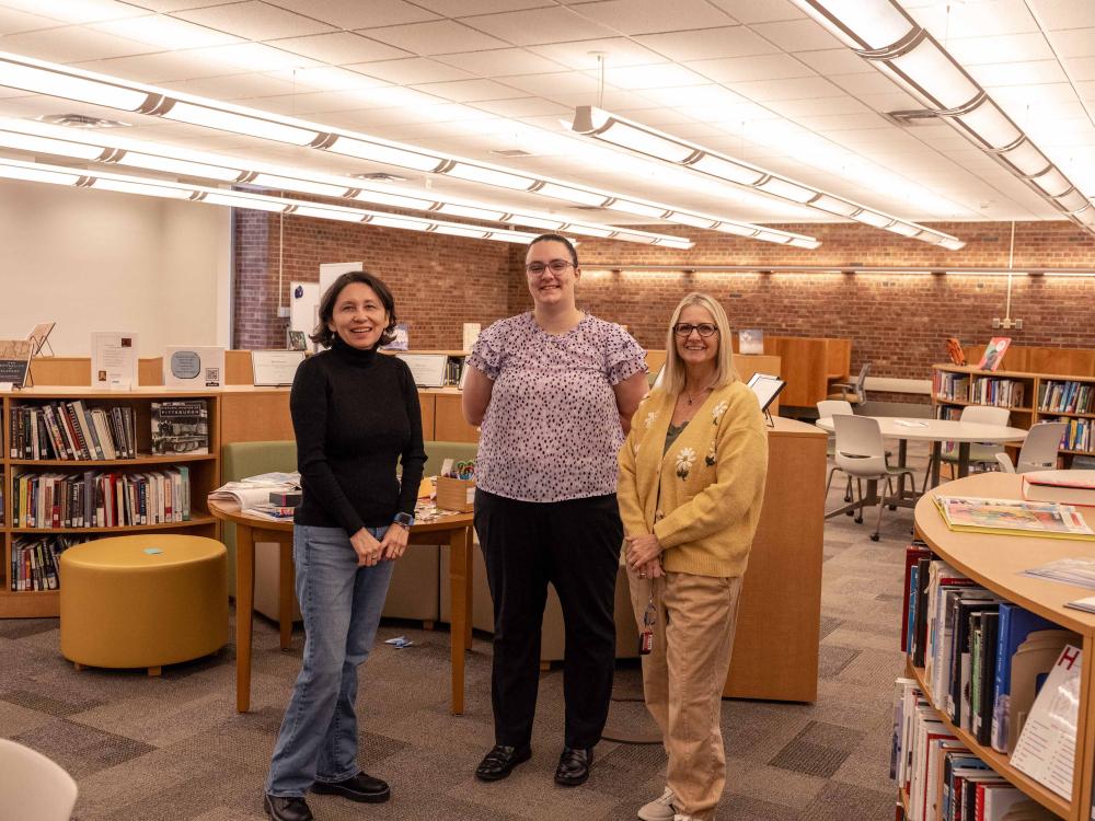 Yesenia Figueroa-Lifschitz, Jennifer Rankin and Ruth Herstek pose together in the New Kensington library.