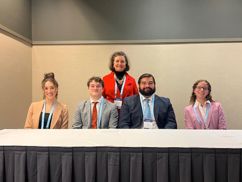 From left, Penn State Greater Allegheny business majors Emma Gatto, Bjorn Sigurdsson and Alexander Mann are pictured with Rachel White, development and communications manager for South Hills Interfaith Movement, and Rosemary Martinelli, assistant teaching professor of marketing and communications, at the Global Impact Forum in Pittsburgh