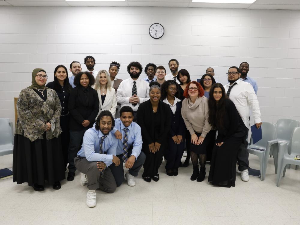students posing for photo in george w. hill chapel with angela putman