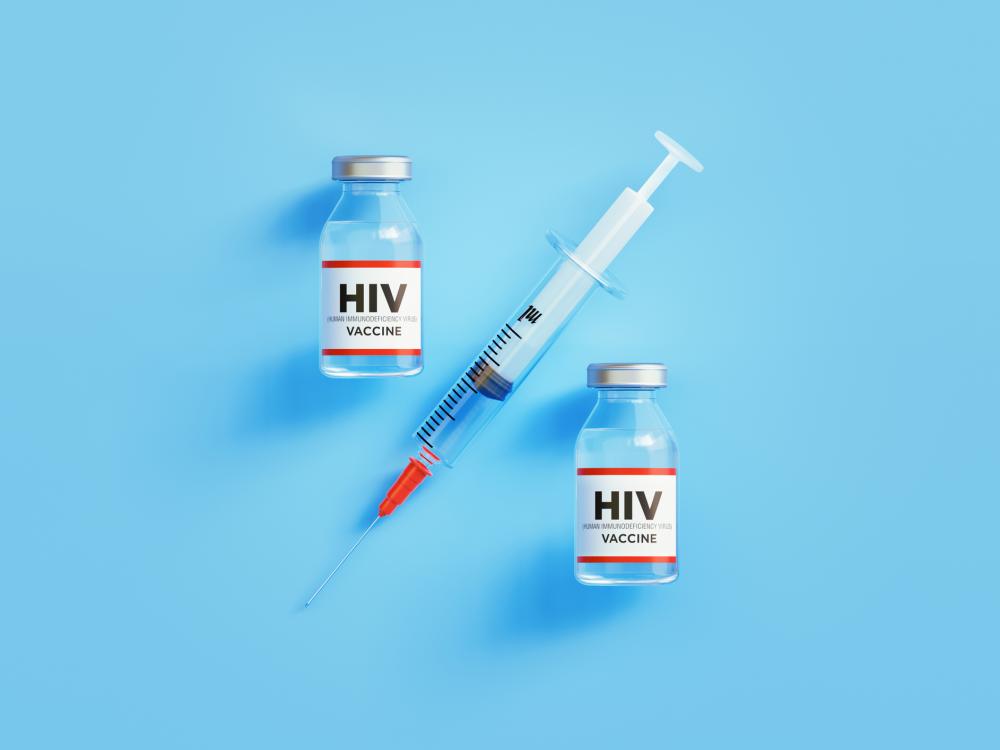 Photo illustration of two vials of HIV vaccine and a syringe