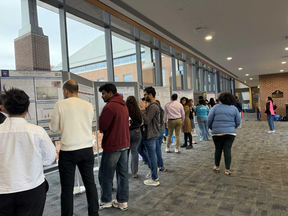 Group of people presenting at the Eberly Research Showcase.