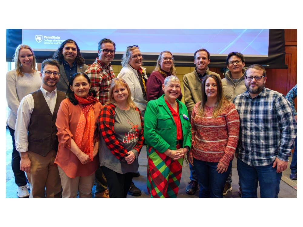 standing rows of people in holiday attire at event