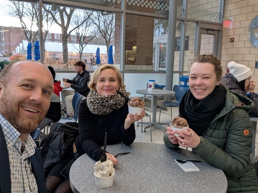A man and two women eating ice cream outside the Berkey Creamery