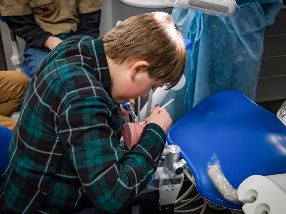 A dental hygiene student at work
